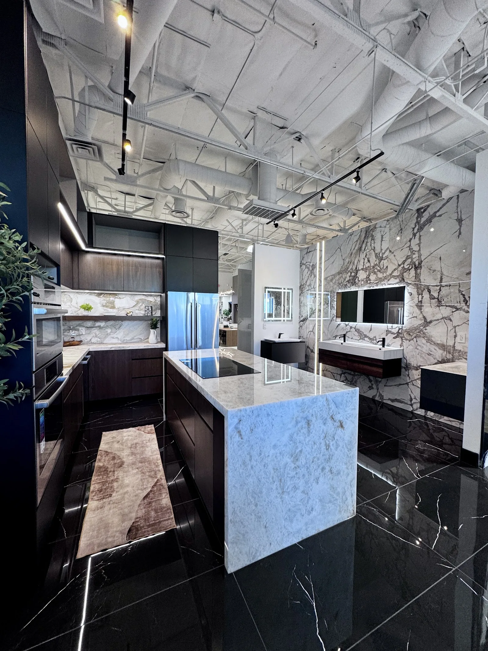 Modern Concepts Design showroom in Las Vegas with marble waterfall island and porcelain tile flooring