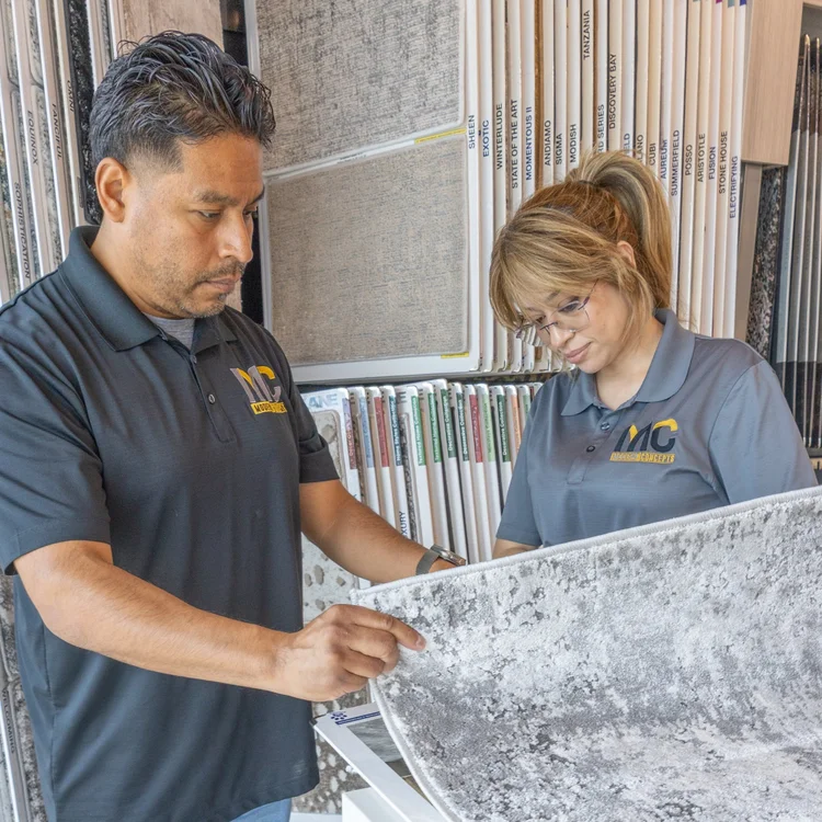 Our team helping a customer choose a carpet sample